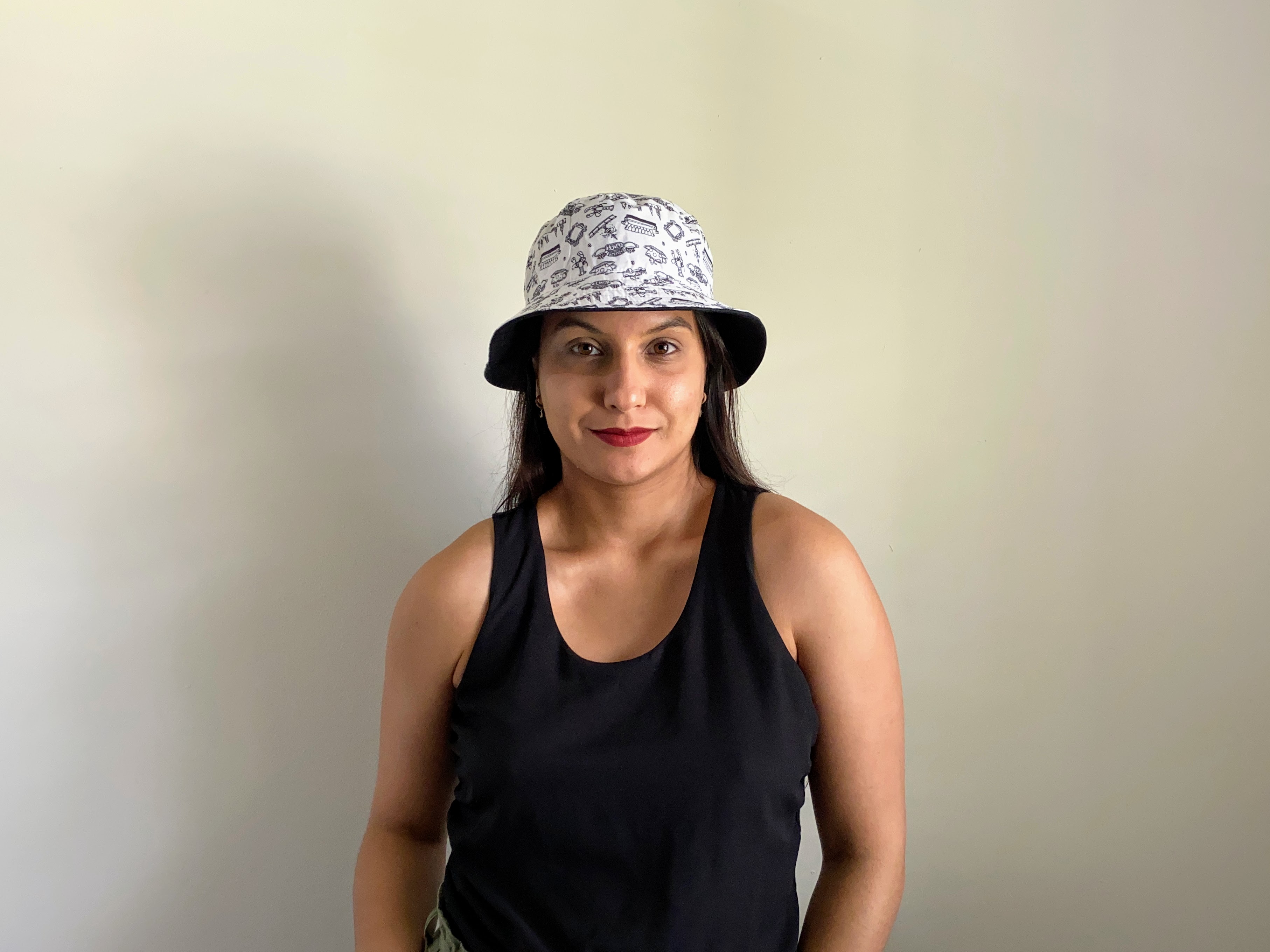 woman wearing a black and white bucket hat