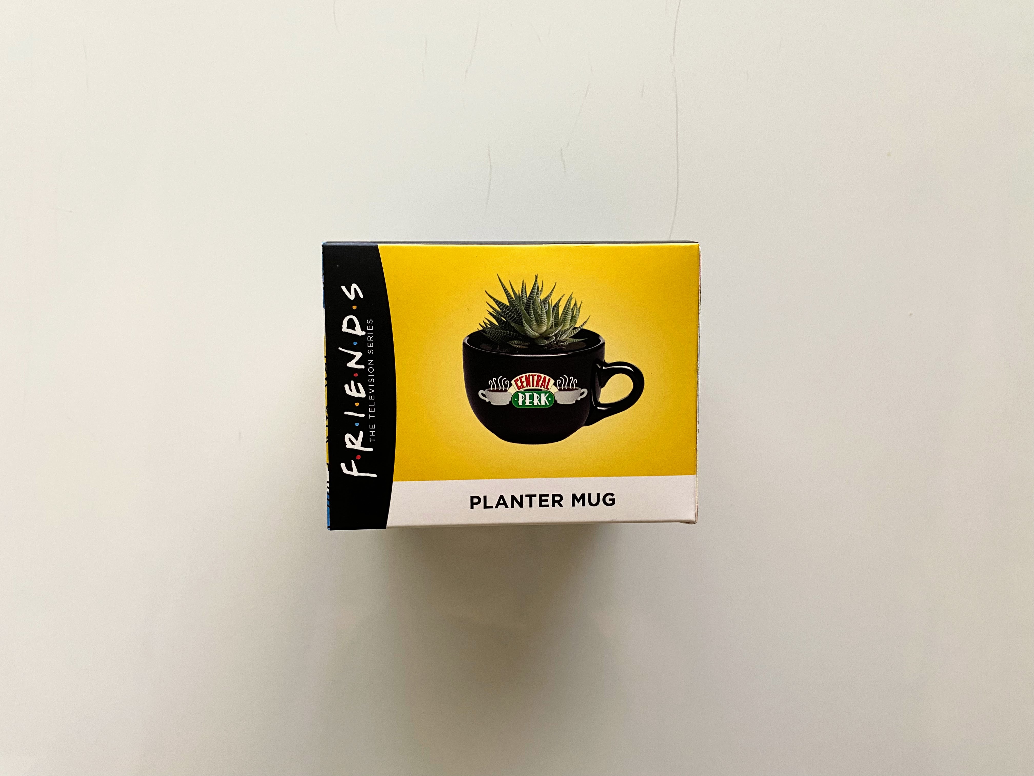 yellow and black box with a planter image