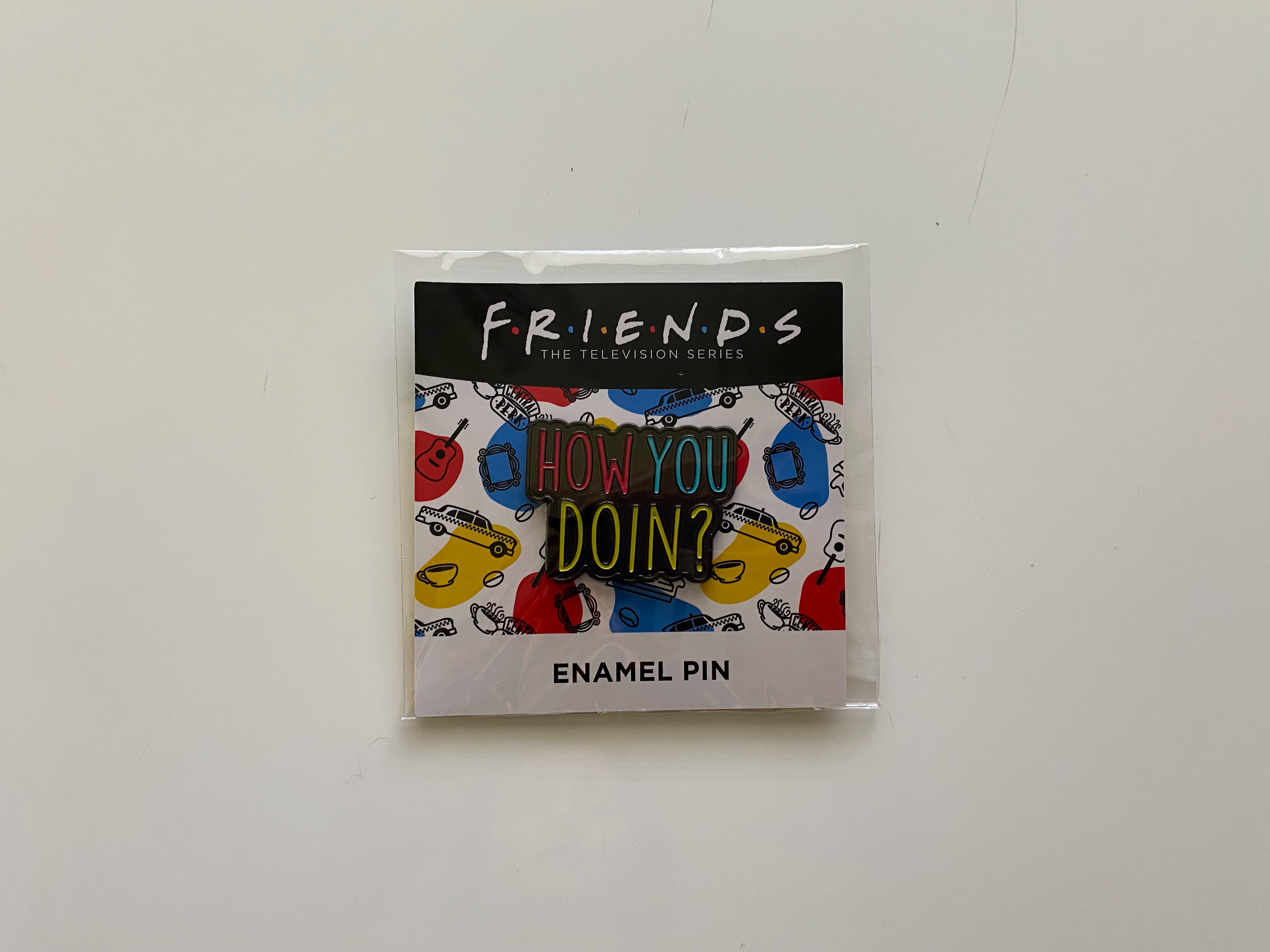 enamel pin in a friends package