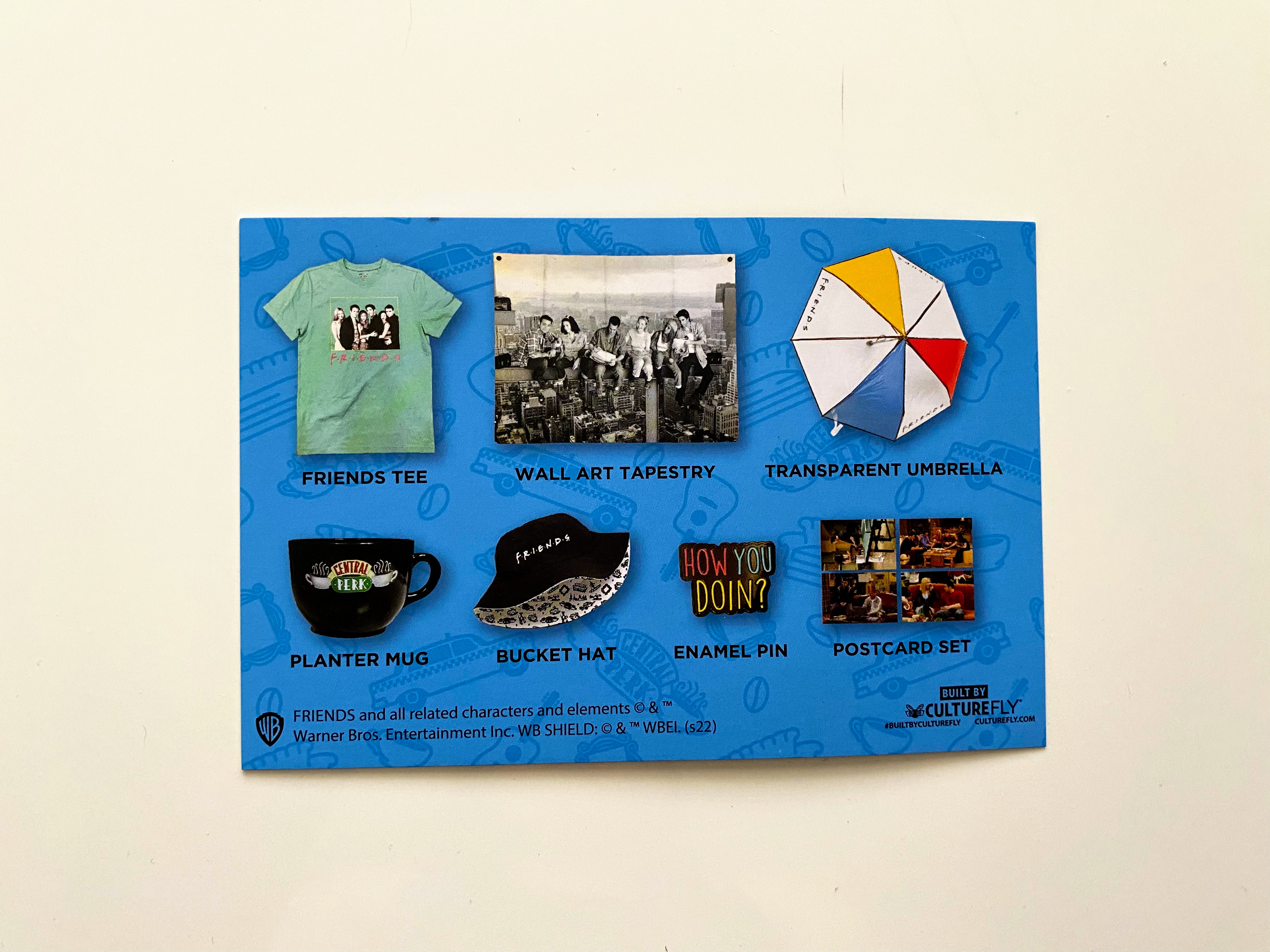 blue card with images of friends box items