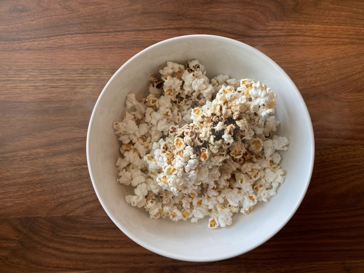 popped popcorn on a white dish