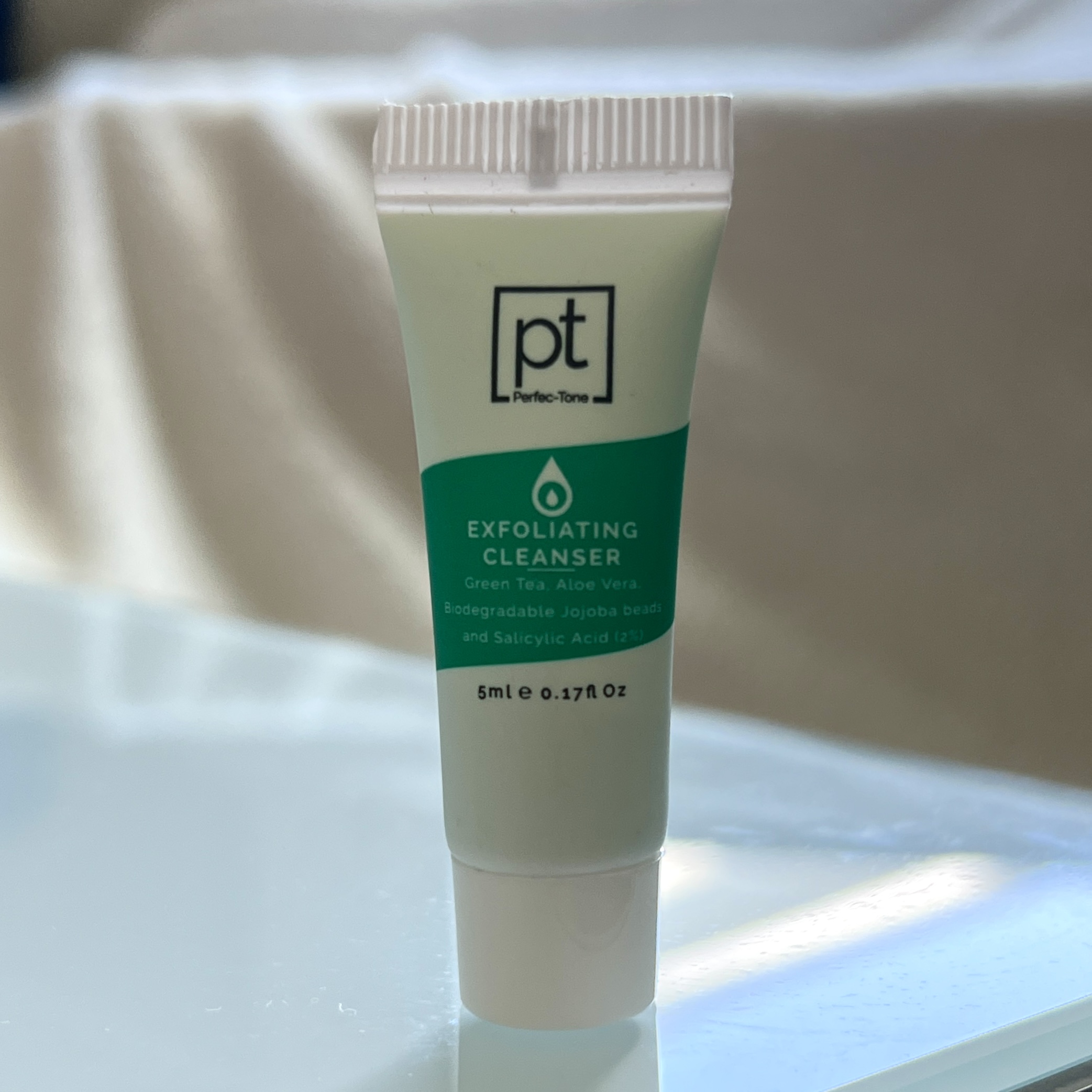 Front of Perfec-Tone Exfoliating Cleanser for Cocotique May 2022