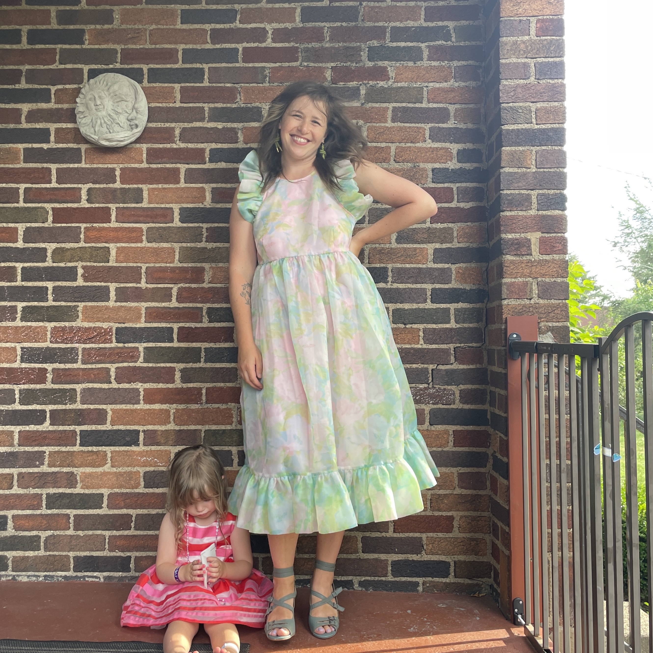 reviewer wearing frilly pastel nuuly dress