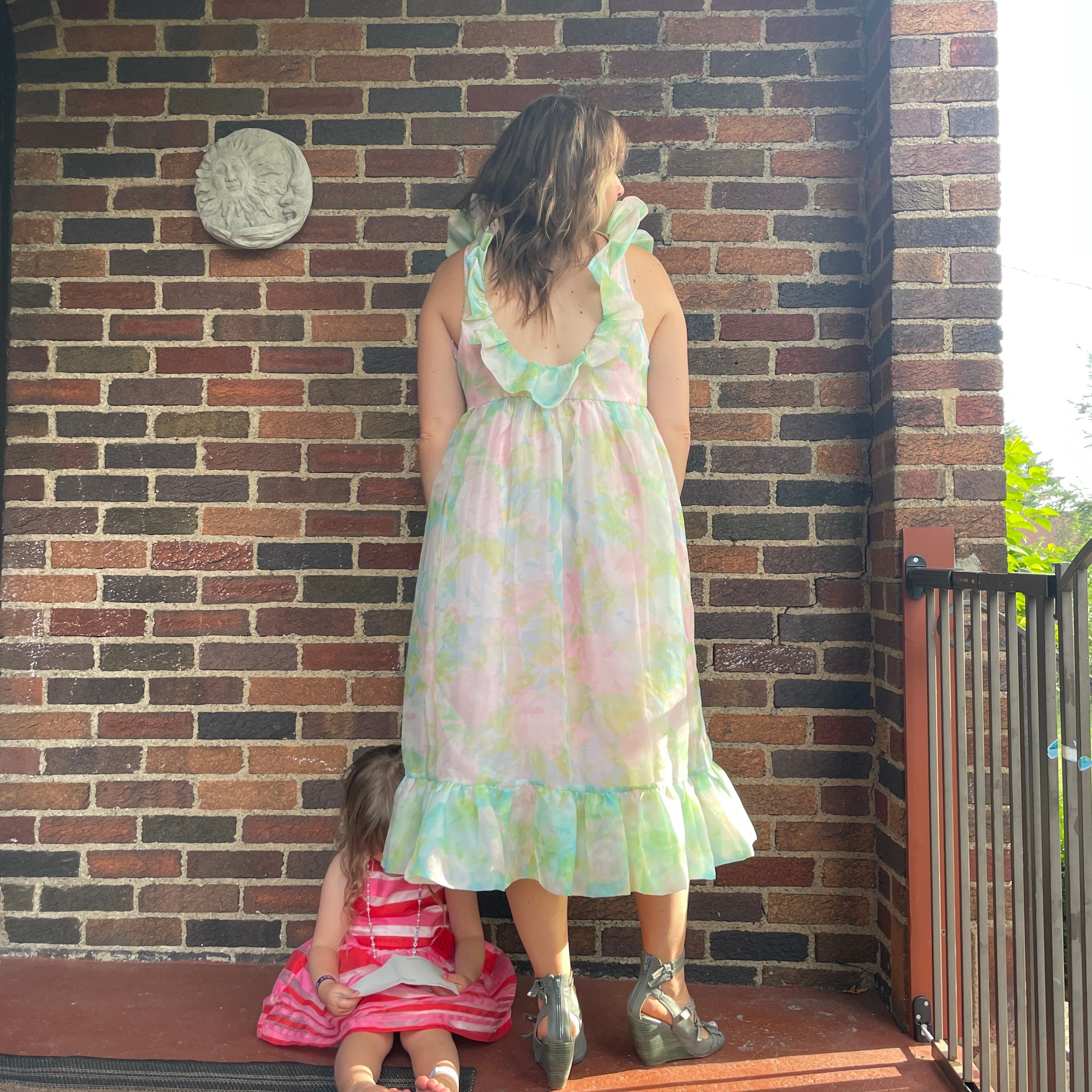 reviewer wearing frilly pastel nuuly dress