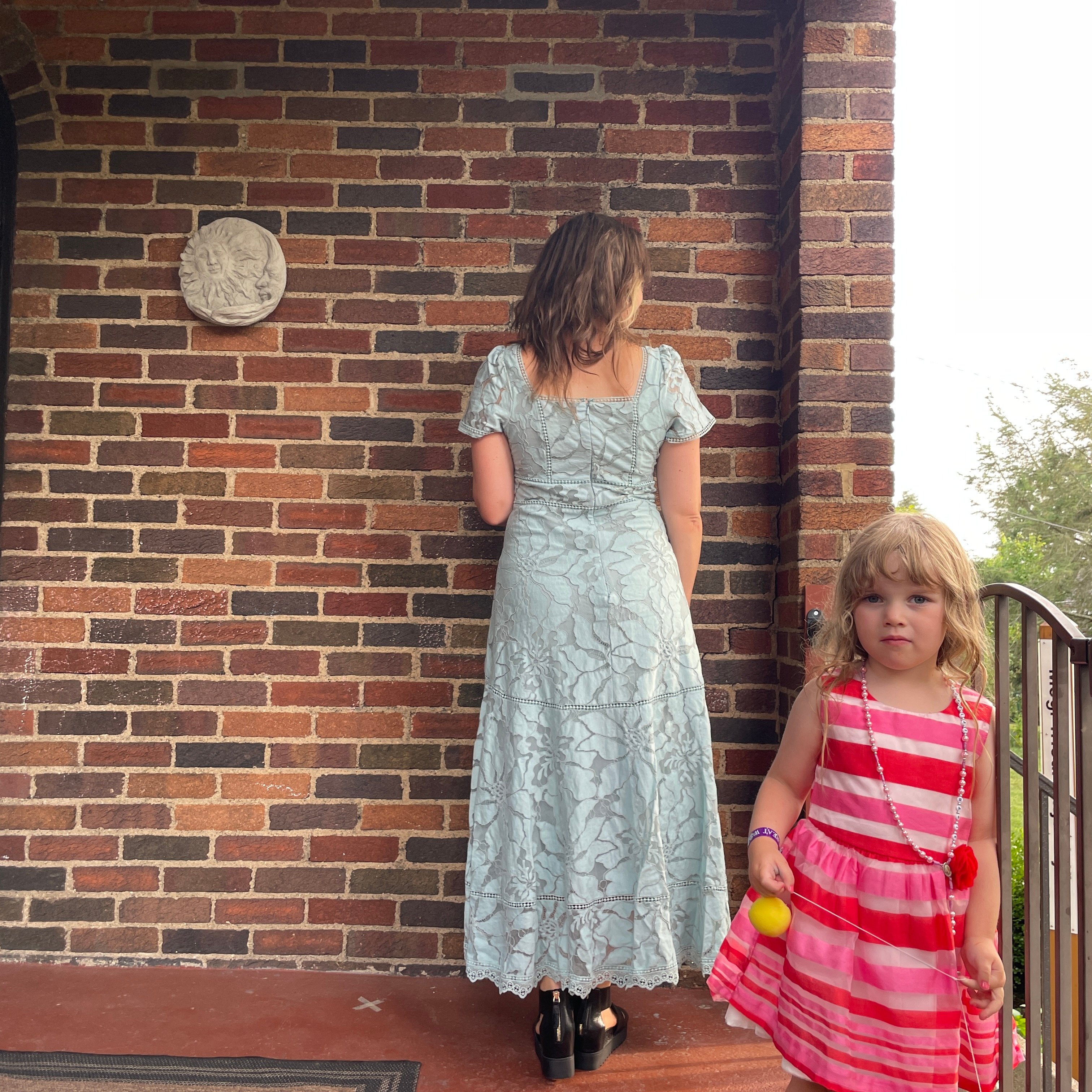 reviewer wearing light blue lace nuuly dress