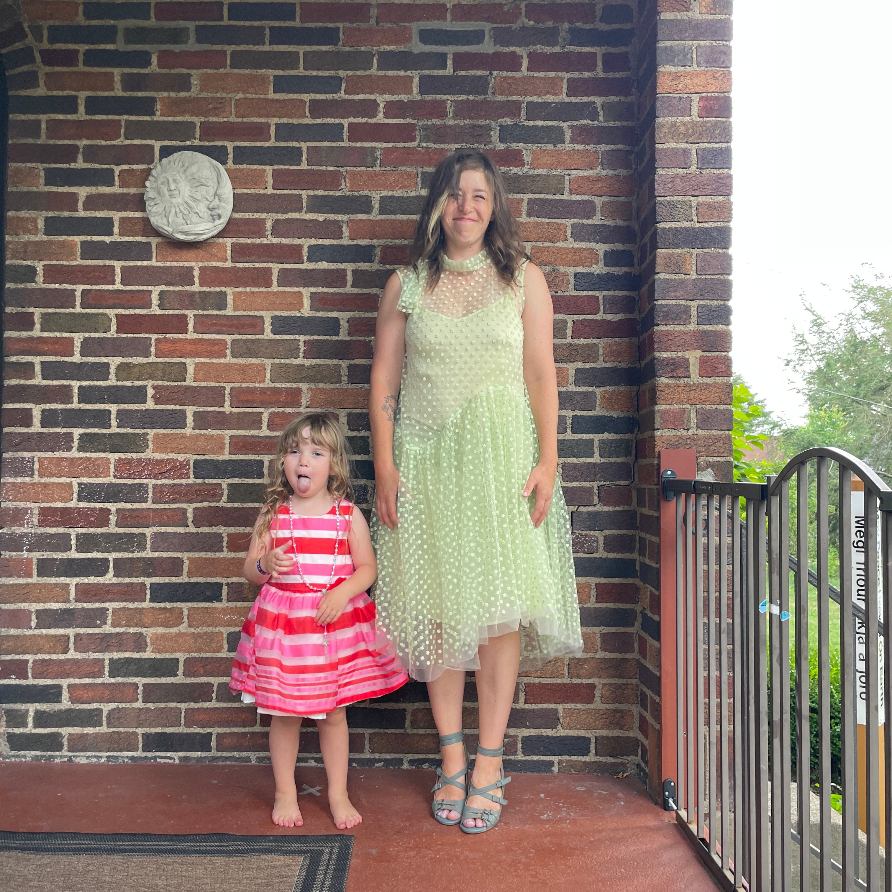 reviewer wearing lime green asymmetrical nuuly dress