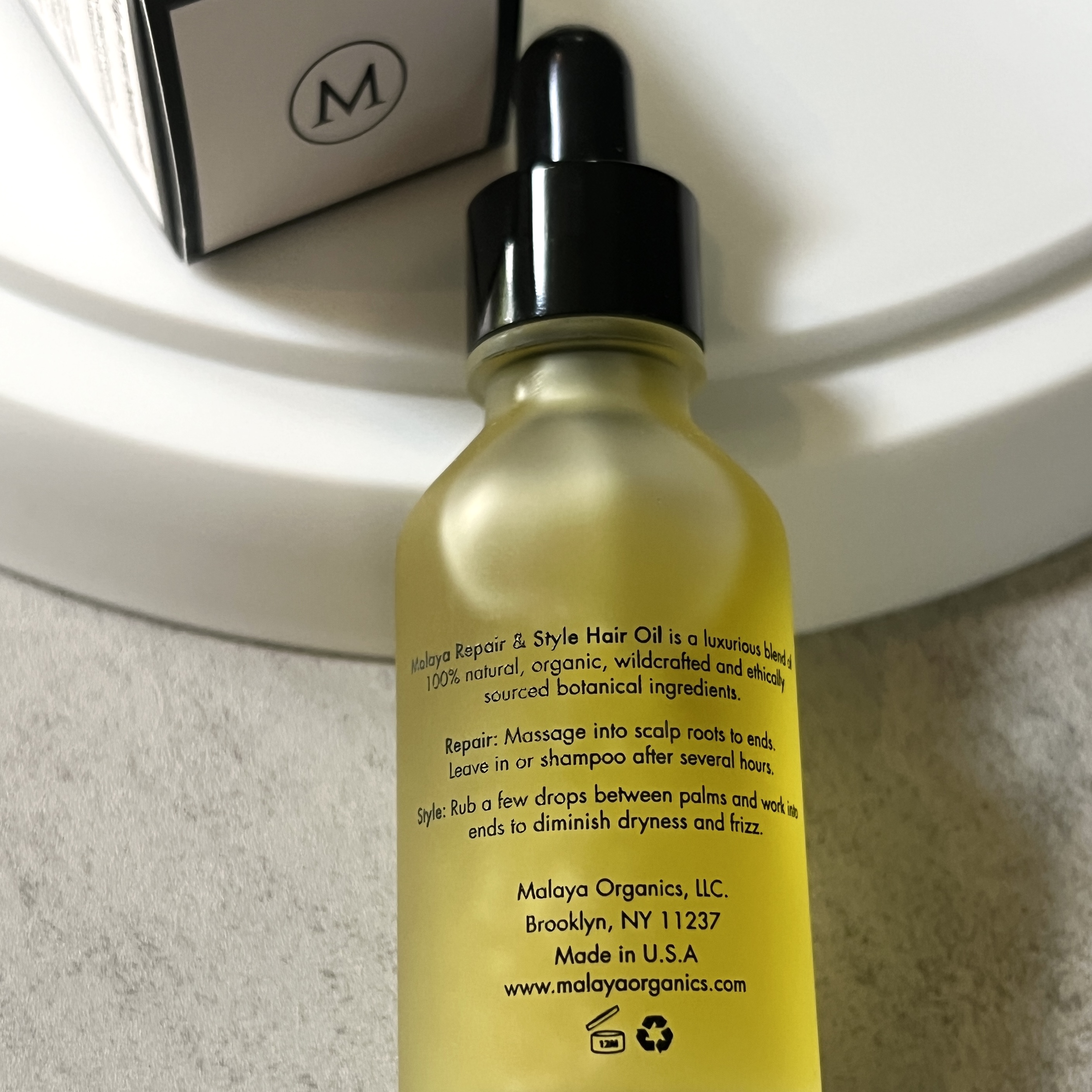 Back of Malaya Hair Oil for Nourish Beauty Box January 2023