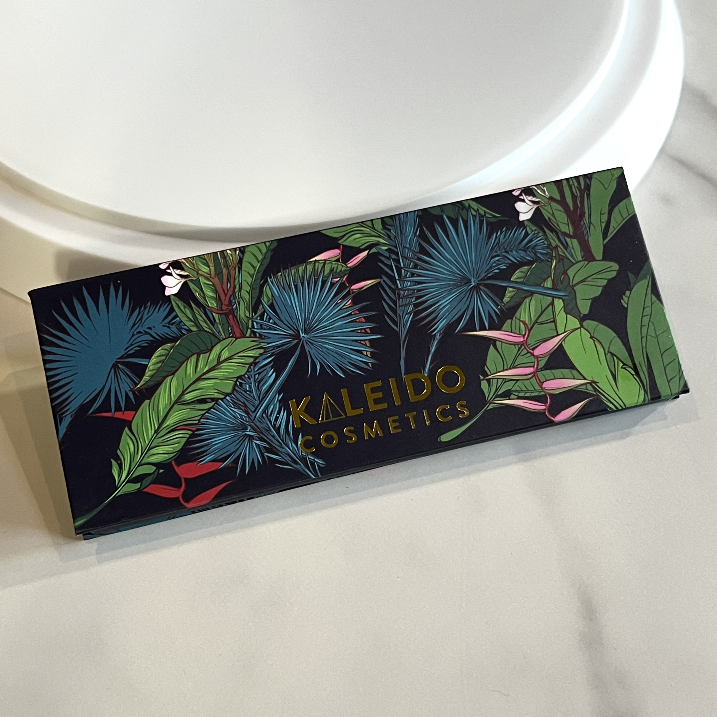 Front of Kaleido Cosmetics Vacay Vibes Eyeshadow Palette for Nourish Beauty Box March 2023