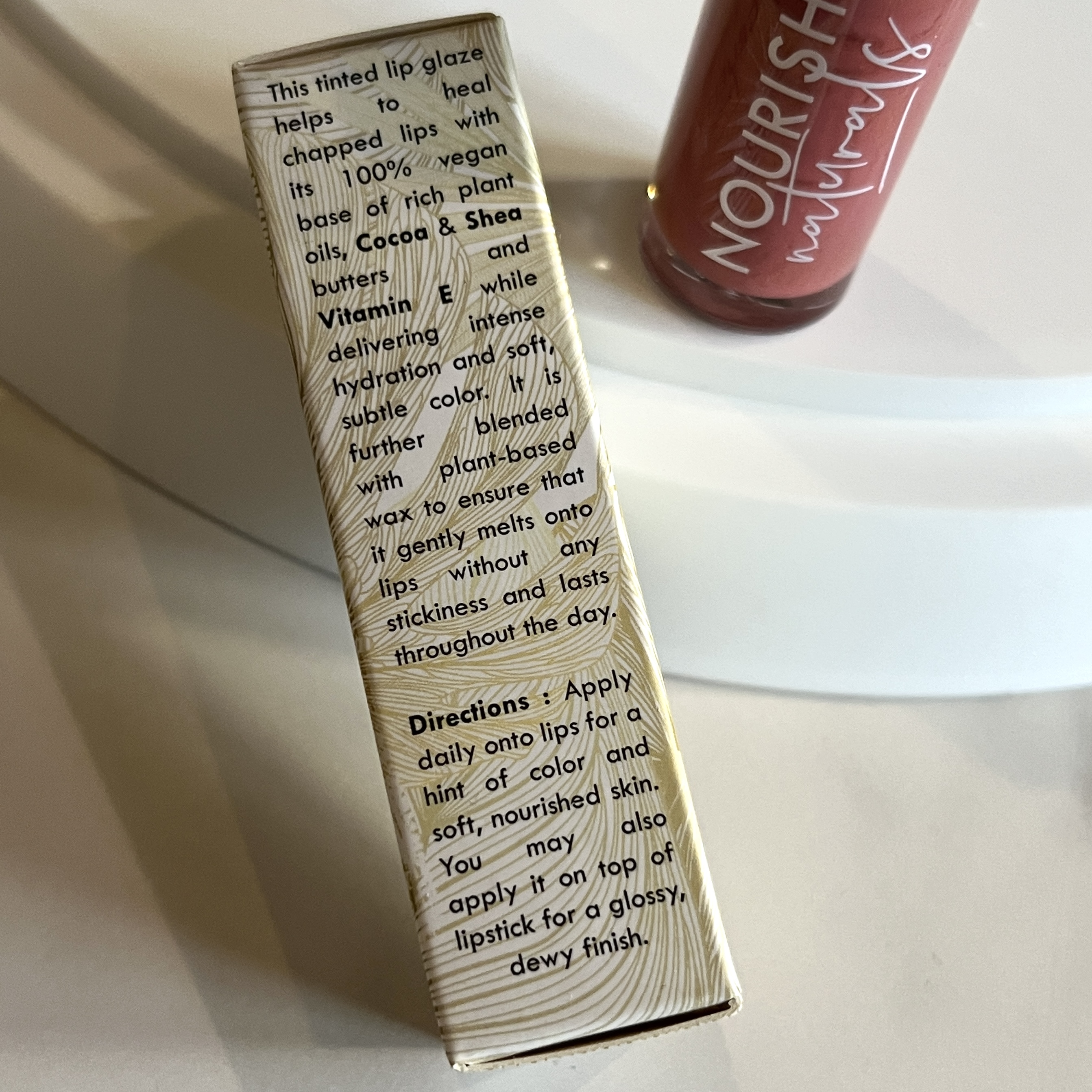 Back of Nourish Naturals Cocoa Glaze Lip Stain in Midsummer for Nourish Beauty Box March 2023