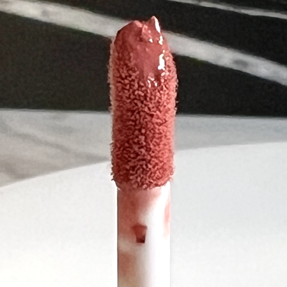 Closeup of Nourish Naturals Cocoa Glaze Lip Stain in Midsummer for Nourish Beauty Box March 2023