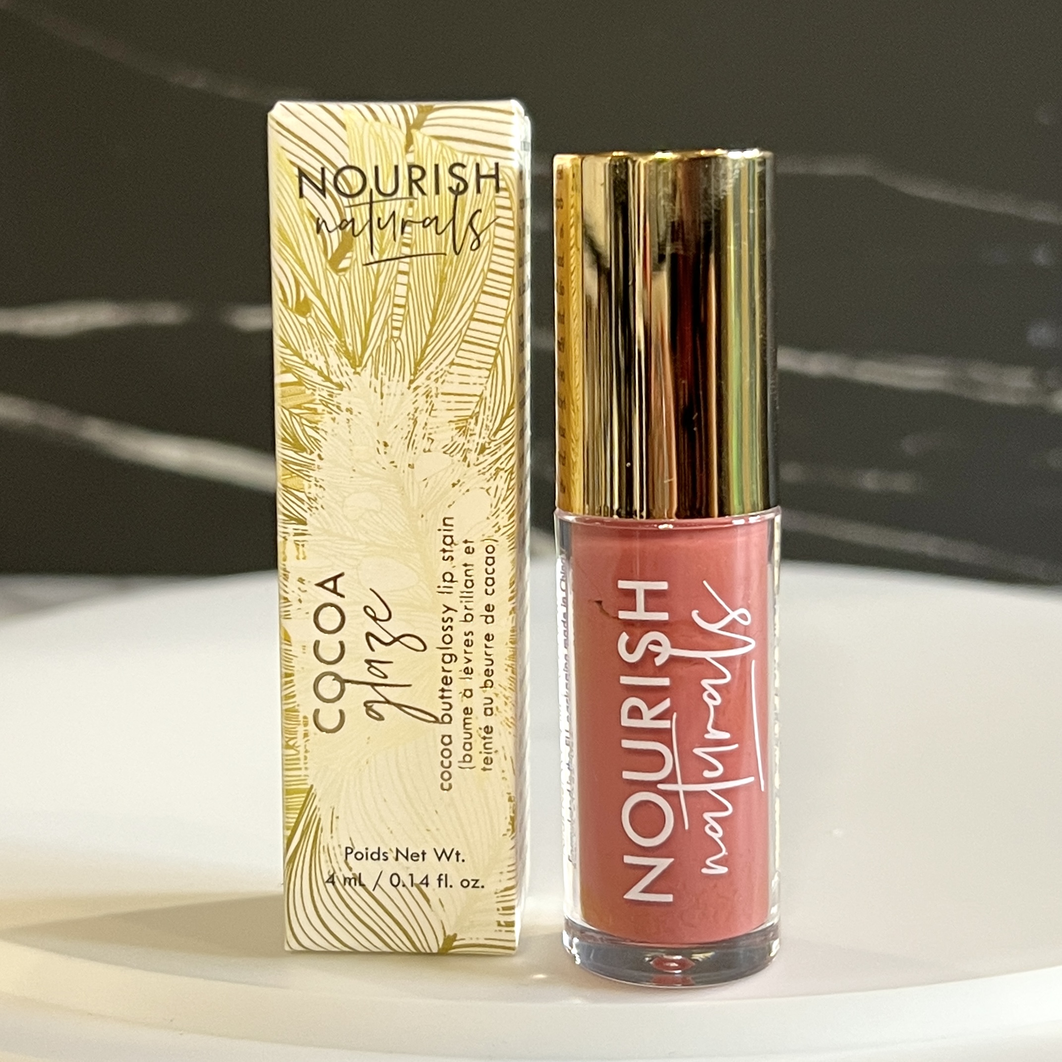 Front of Nourish Naturals Cocoa Glaze Lip Stain in Midsummer for Nourish Beauty Box March 2023