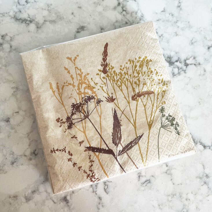 flowered paper napkins sit on a countertop