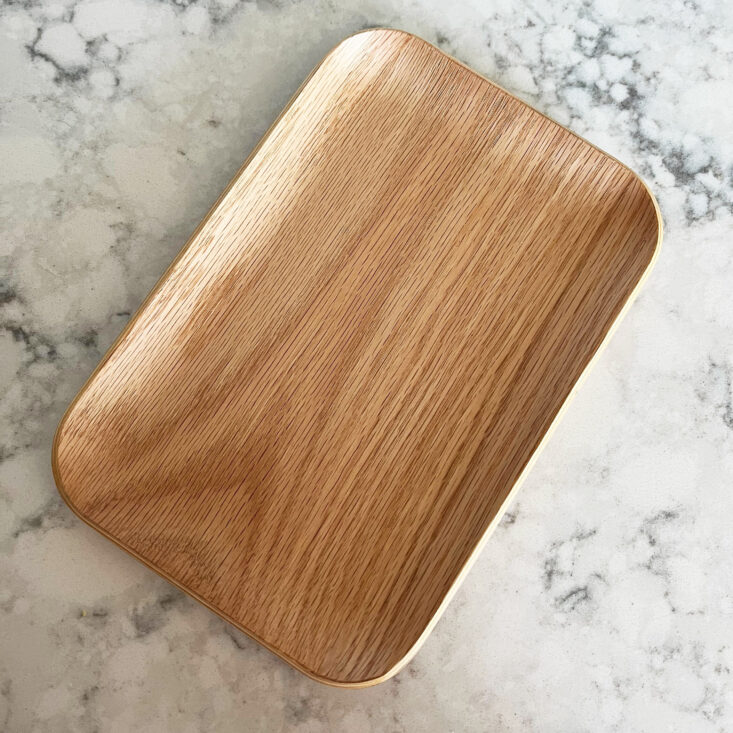 oak plate sits on a marbled countertop
