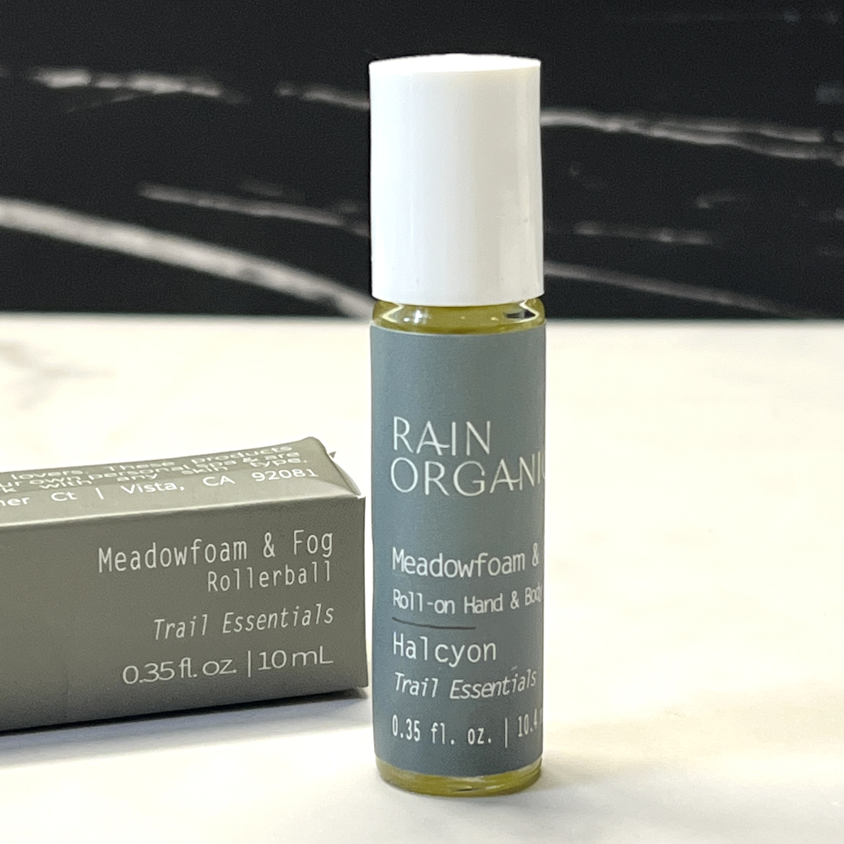 Front of Rain Organica Rollerball for Nourish Beauty Box April 2023