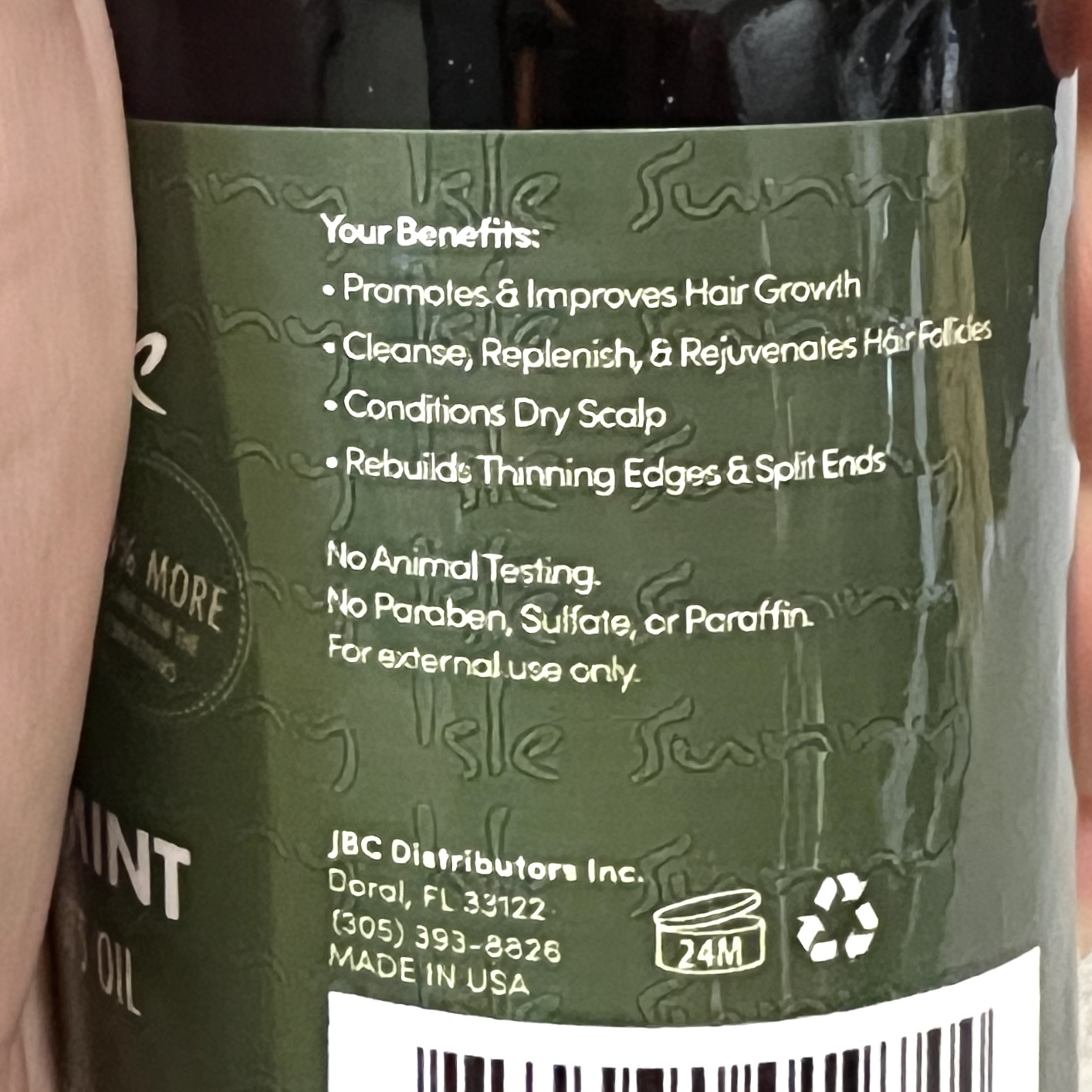 Back of Sunny Isle Hair Oil for Cocotique October 2023