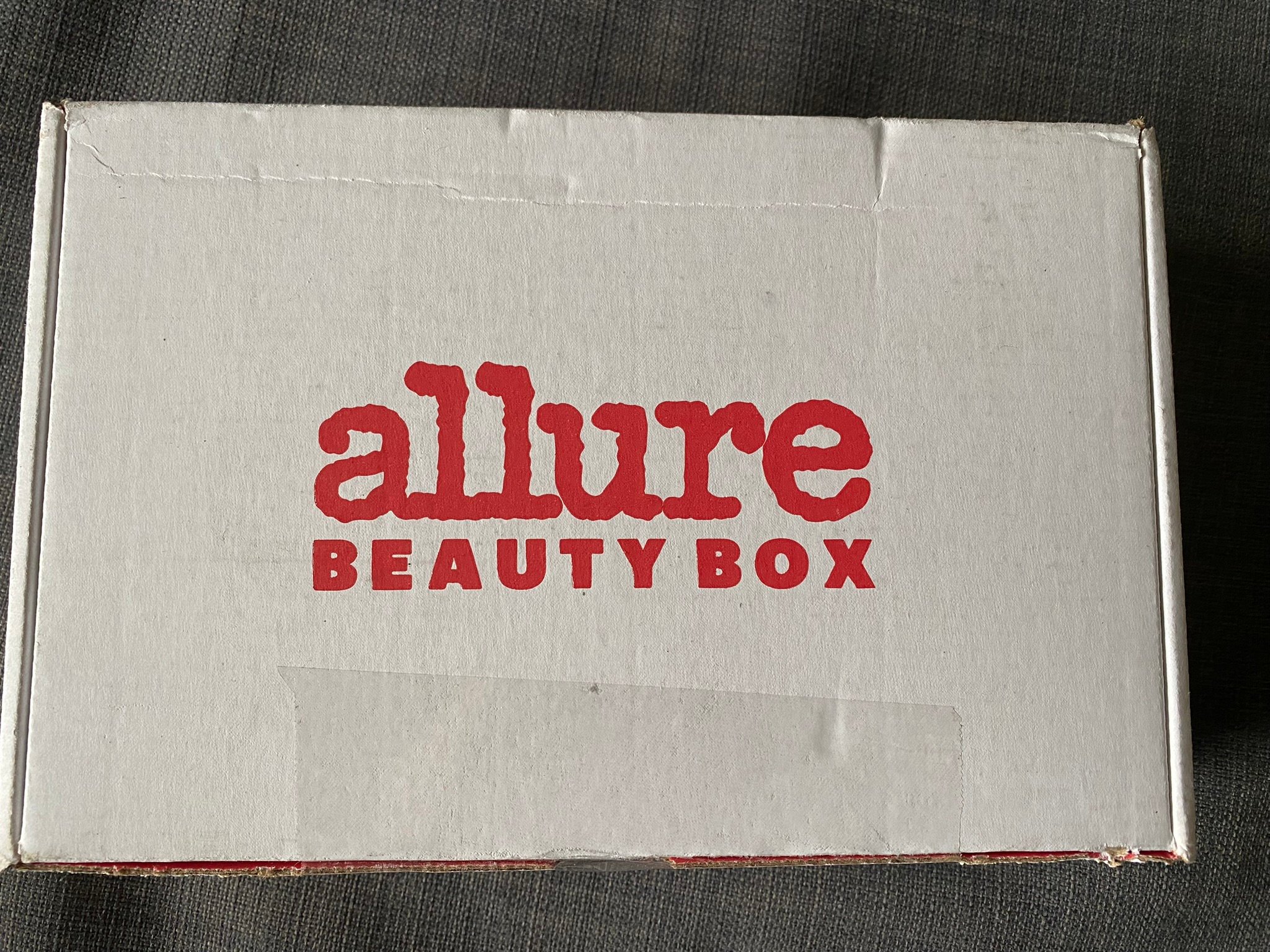 White box with red type that reads "Allure Beauty Box"