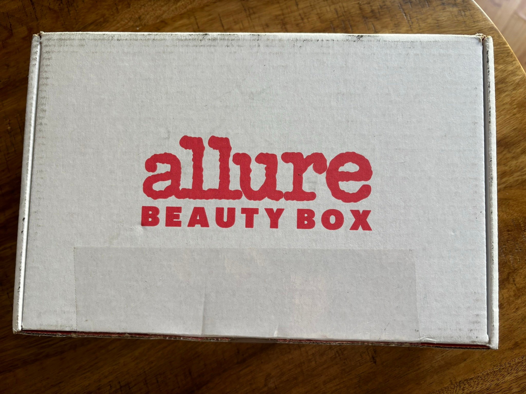 white box with red text that says Allure Beauty Box