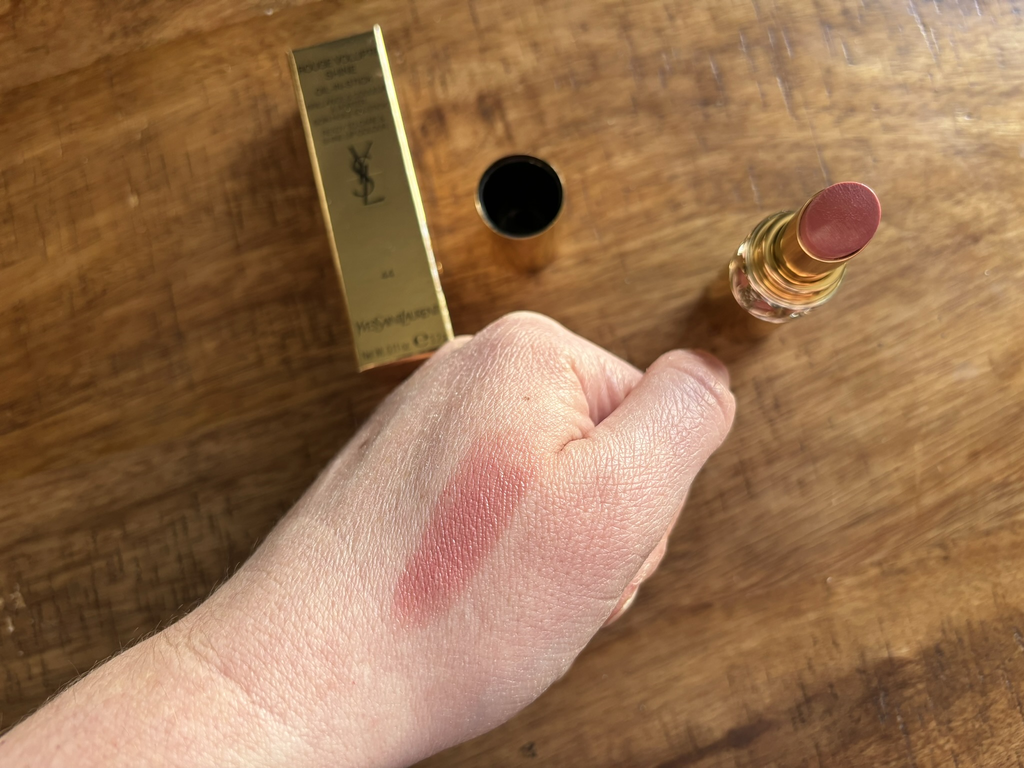Yves Saint Laurent lipstick in Nude Lavalliere shade swatched on a hand