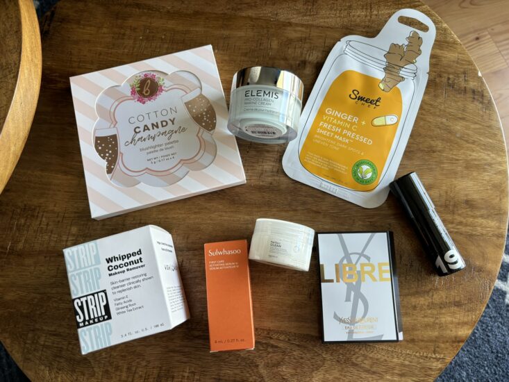 skincare and makeup products on a wood table