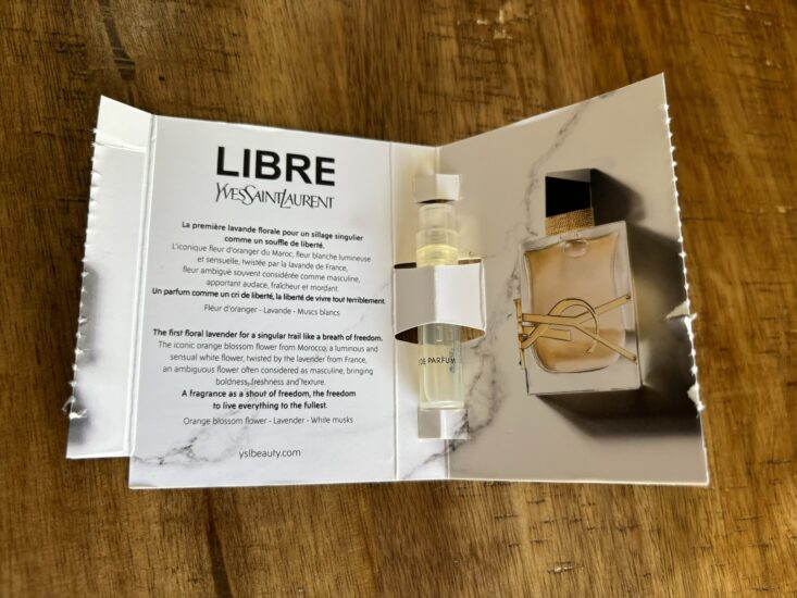 YSL Libre perfume sample open to reveal miniature perfume sprayer inside cardboard holder