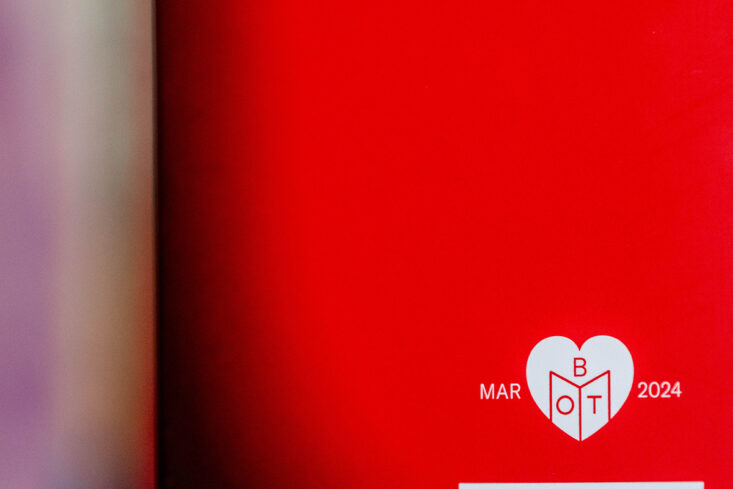 A red book cover with the text Mar 2024 and the Book of the Month logo on it