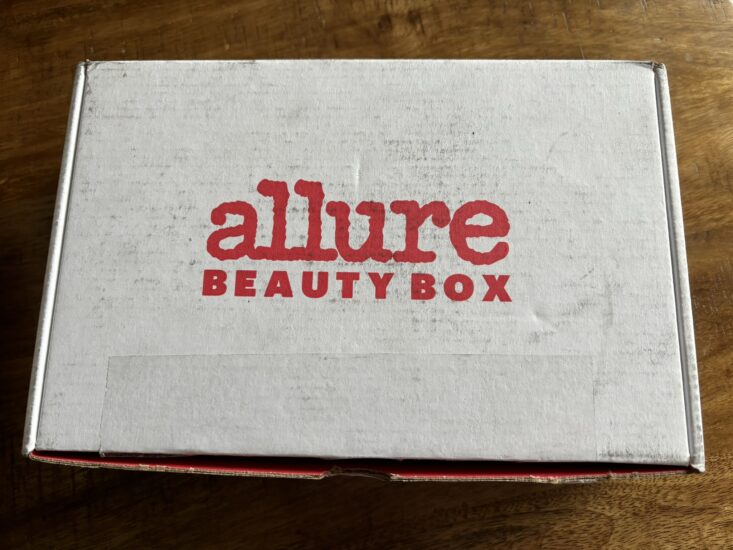 white box with red text that reads Allure Beauty Box