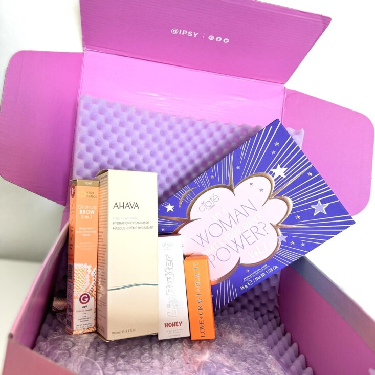 beauty products inside the ipsy pink box