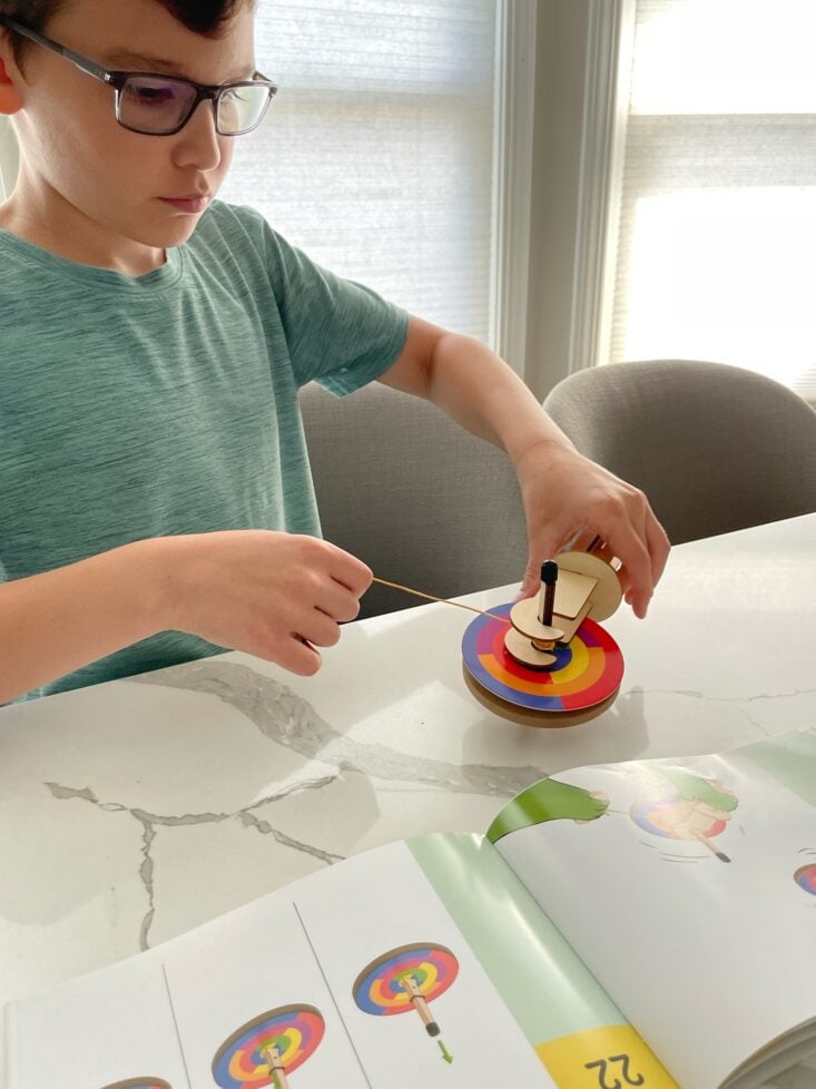 Judith's son building his gyroscope from MEL Science.