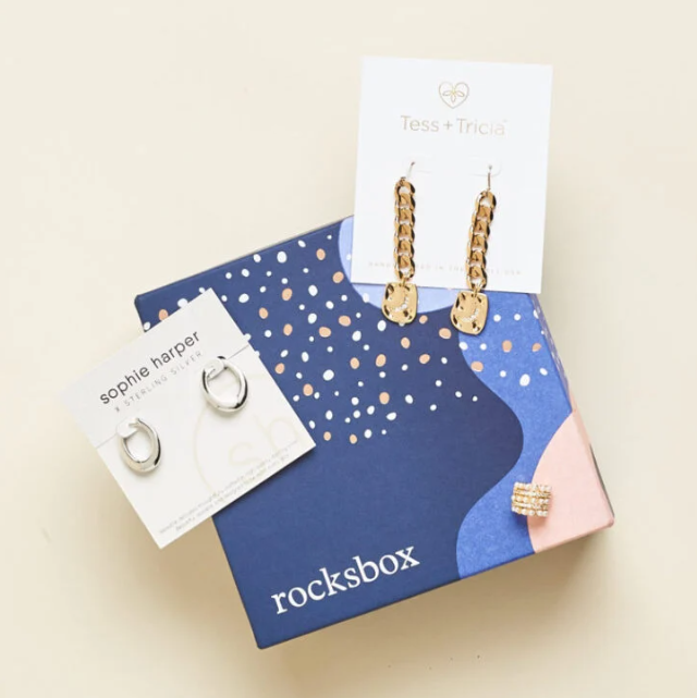 A pair of sterling silver earrings and a pair 14k gold earrings from Rocksbox.