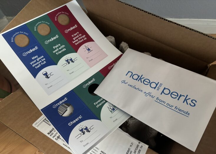 Naked Wines gift vouchers, partner offers, and packing list inside Naked Wines delivery box