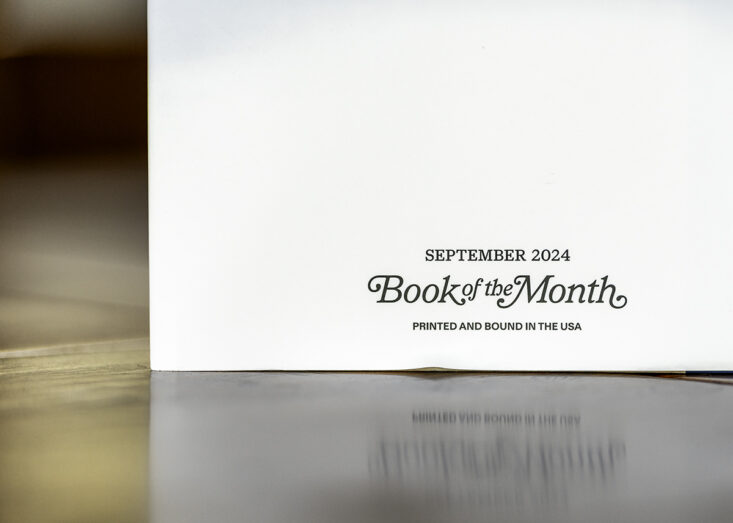 September 2024 Book of the Month text on the back of a white book cover