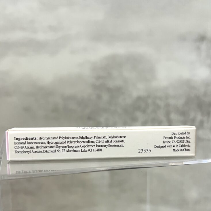 Back of Billion Dollar Beauty pH Lip OIl for BirchBox October 2024