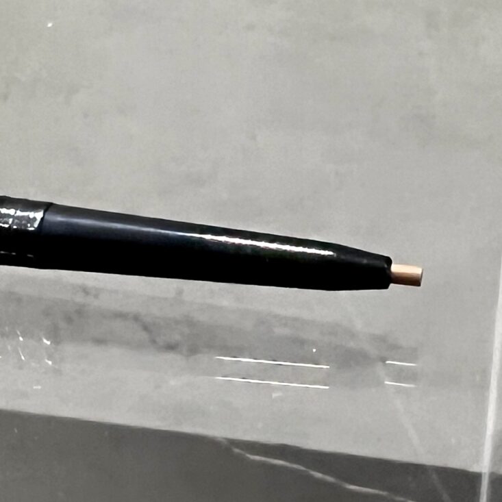 Closeup of Black Radiance Eyebrow Pencil for Cocotique September 2024