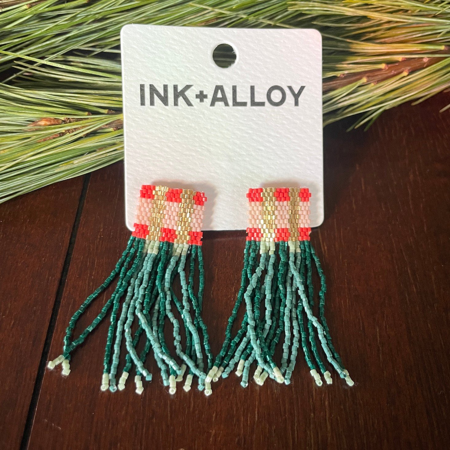 A pair of beaded earrings from Ink+Alloy.