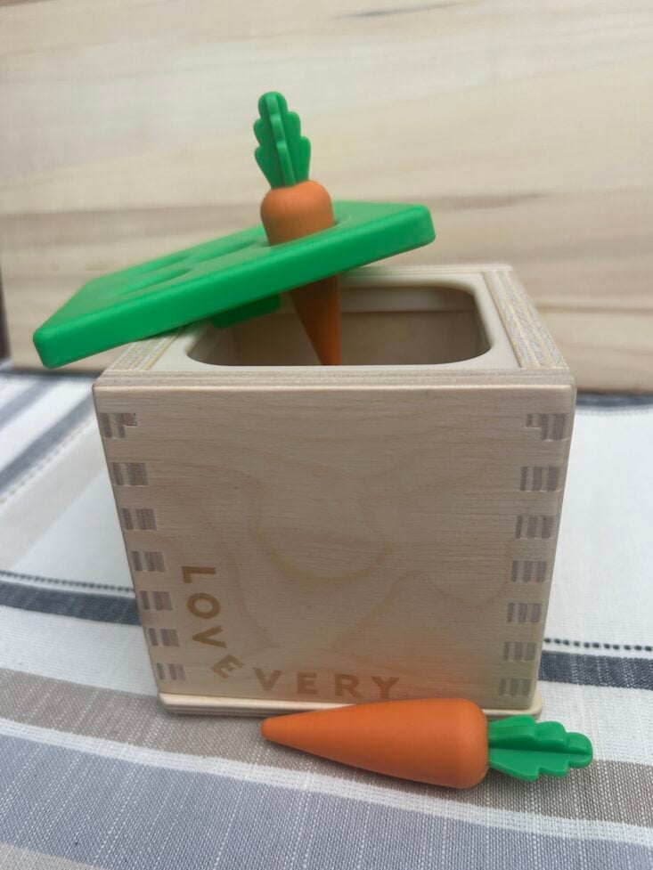 lovevery carrot toys on top of box