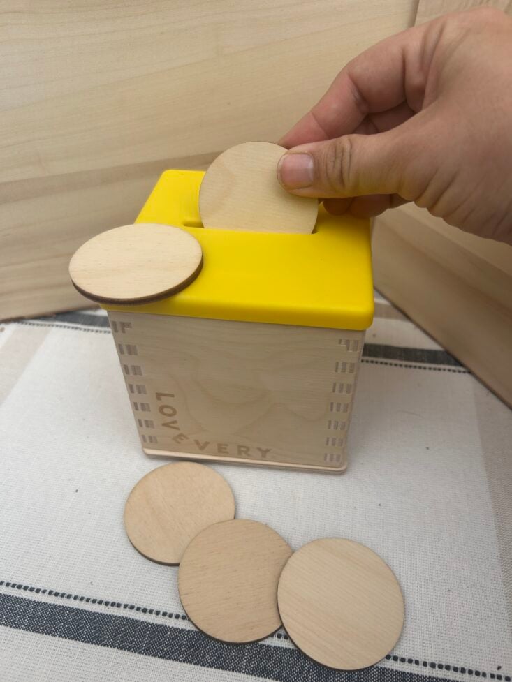 playing with lovevery coin box