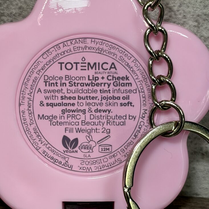 Back of Totemica Beauty Keychain for Ipsy Original April 2026